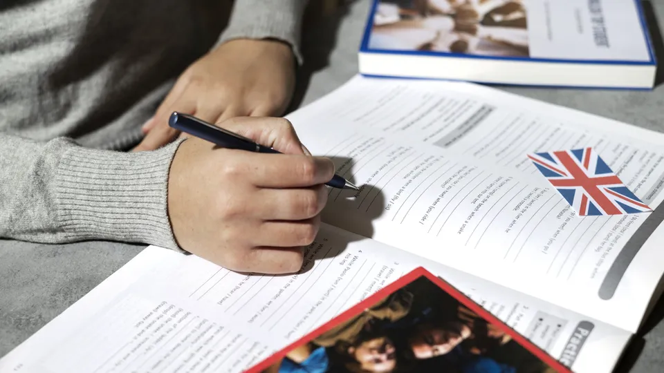 Student reading a study abroad guide